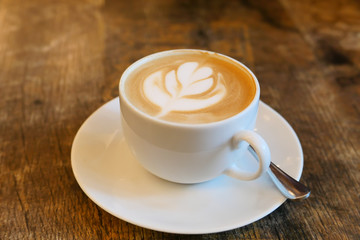 late coffee with flower design, top view