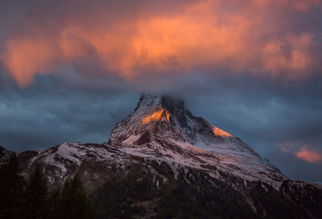 Epic view to Matterhorn peak in clouds, scenic morning landscape, Switzerland.