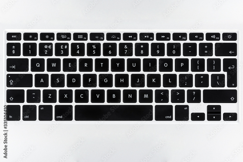 Aufkleber close up top view on a laptop keyboard with flat buttons
