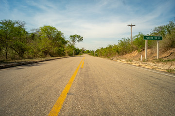 Fototapeta na wymiar Asphalted and Dirty Road to Puerto Viejo in the Charagua Zone of Santa Cruz Province, Bolivia