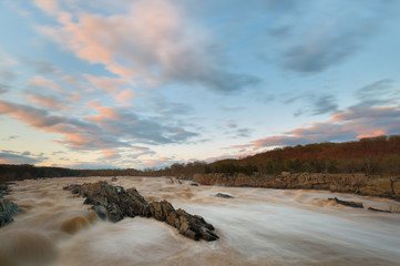 Over View of Rapids of Potomac River in Slow Motion at Sunset in Great Falls Park, Virginia. Great Falls Park is a small National Park Service site in Virginia near Washington DC, United States.