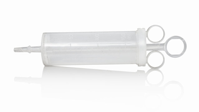 Large plastic medical 150ml syrette for ear irrigation. Isolated on white background with shadow reflection. Big plastic syringe on white bg. Large hypodermic.