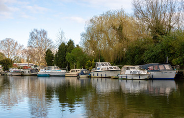 Fototapeta na wymiar Calming river view with boats resting