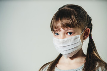 girl in a medical mask