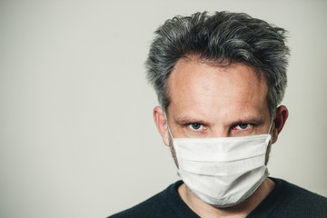 middle-aged man in a medical mask