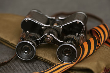 Military binoculars, military cap and St. George's ribbon. Symbol of victory on may 9. Second world...