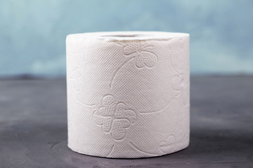 One toilet paper rolls on a gray background