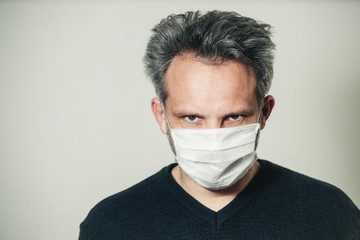 middle-aged man in a mask on a white background
