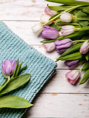 Scarf, and flowers on a white background.Flat lay, top view