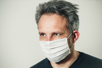middle-aged man in a medical mask