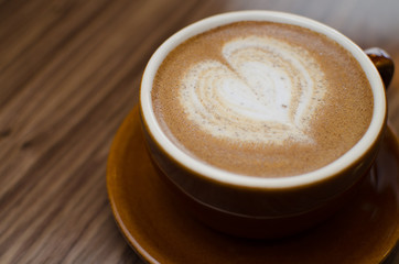 cup of coffee on wooden table