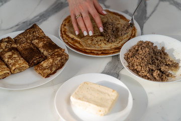 cooking delicious pancakes with meat filling