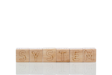 Wooden cubes with letters system on a white background