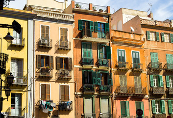 Cagliari, Sardinia, Italy - Historic old buildings with windows with shutters and balconies in the city center on Cagliari