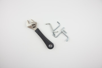 Adjustable wrench and screws. Tools do not fit. For housework.