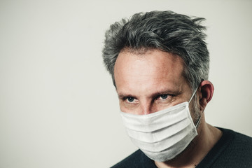 middle-aged man in a medical mask