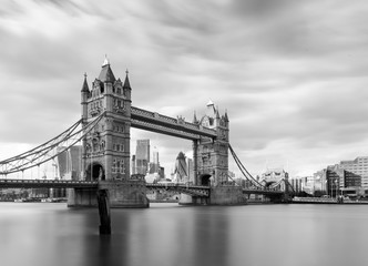 Fototapeta na wymiar Tower bridge in black and white during the day. Long exposure