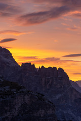 Fototapeta premium Aerial view of Cadore di Misurina photographed at sunrise. A small town famous for its lake and the nearby three peaks of Lavaredo