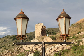 street lamps on the background of an ancient castle