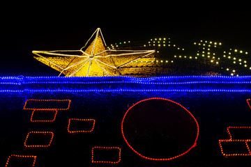 Medellin, Antioquia / Colombia - January 6 2020: Star Lit up at the Medellin Holidays Light Fair in Parque Norte (North Park)
