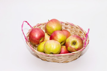 apples in a basket on a white background close up