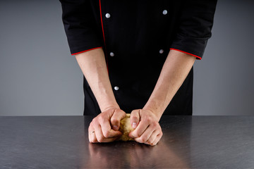 cooking dough sprinkling flour in a restaurant kitchen1