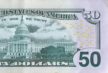 US Capitol on 50 dollars banknote back side closeup macro fragment. United states fifty dollars...