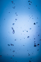 dancing red water in mid air with blue gradient background