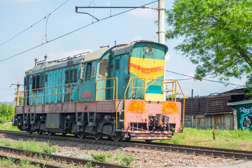 Obraz premium Old railway train rides on rails. Old train