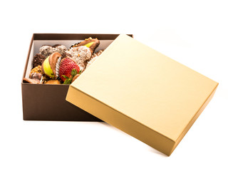 Strawberries covered with chocolate, hazelnuts