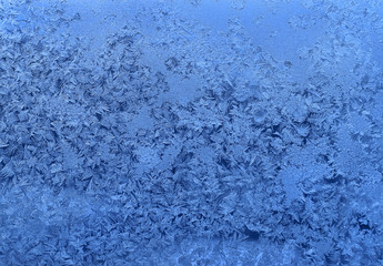Fototapeta na wymiar Natural ice pattern on winter glass