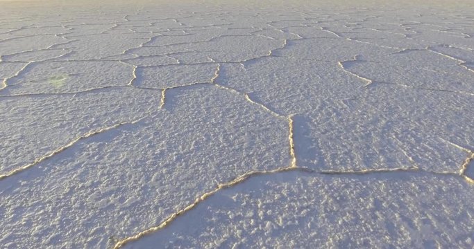 Travelling Through Salt Tiles Aerial View in the Famous Uyuni Salt Flat at Sunrise
