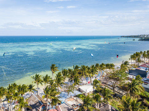 Palm trees and kite boarding on Bulabog beach, Boracay island, Philippines