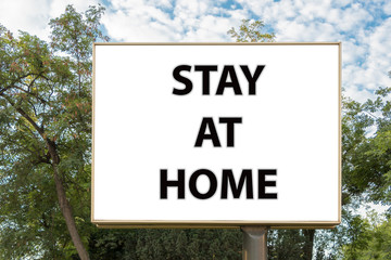 Fototapeta premium Stay at home text on billboard. Virus prevention concept