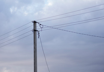 A power line pole with electrical wires isolated against the sky. Power line, power supply