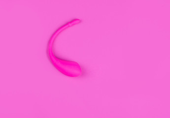 Female lush pink vibrator, on a pink background. Intimate theme for women.
