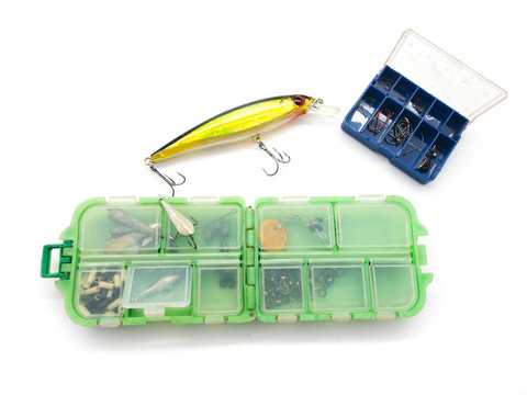 Boxes with hooks and vobler isolated on a white background. Metal hooks in the box. Set of fishing box and vobler.