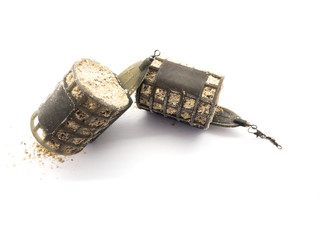 Fishing troughs and fish bait isolated on white background. Set of fish feeders. Fishing tools. Carp fishing lure. Plastic pouch.  