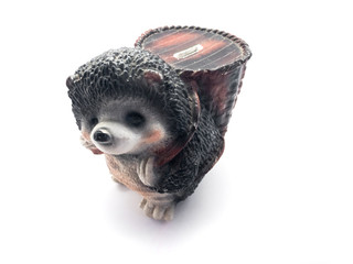 Piggy bank isolated on a white background. Piggy bank in the form of a hedgehog. Piggy bank and banknotes.