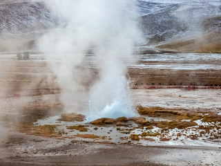 Beautiful landscape of geysers of El Tatio in winter and snowy.