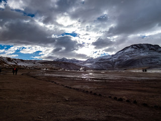 Fototapeta na wymiar Beautiful landscape of geysers of El Tatio in winter and snowy.