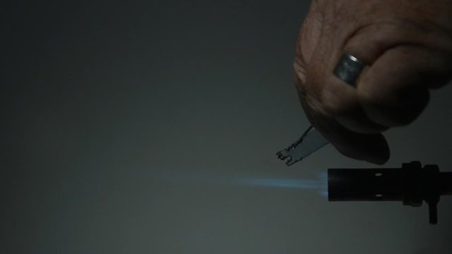 A Beilstein test can reveal halogens in plastic. Copper wire is heated and put on the material to test. PVC contains chlorine. The flame turns green color when the copper wire is put back in the fire