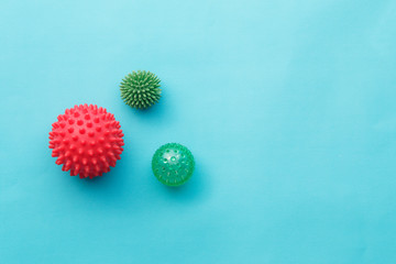 Concept. Colored different coronavirus molecules. COVID-19. Blue background. Copy space.