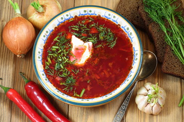 Still-life with borsch with vodka on a festive table
