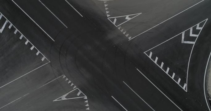 Trucks cross the intersection top view 