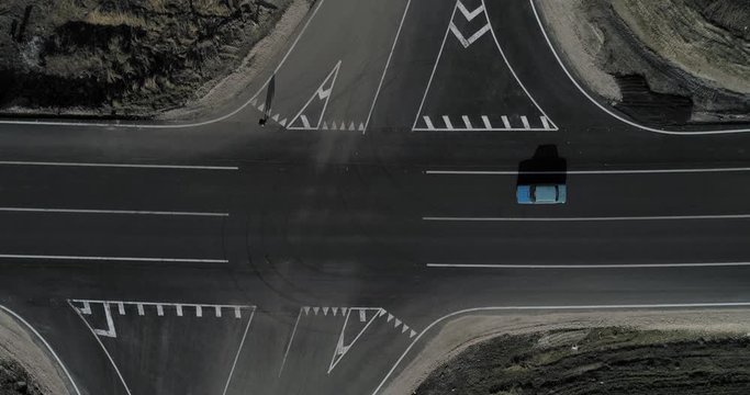 The pedestrian crosses the unregulated intersection