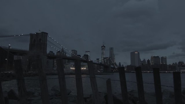 Brooklyn Bridge Manhattan skyline at dusk New York ungraded in HD tracking shot