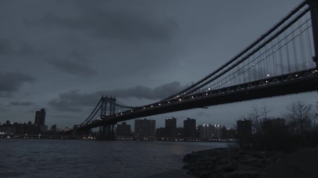 Brooklyn Bridge Manhattan skyline at dusk New York ungraded in HD panning shot