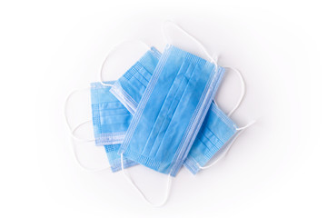 Medical respiratory mask protection against coronavirus. Covid-19 virus safety blue masks isolated on white background. Surgical hygienics bandage face. Antiviral infection mask with clipping path
