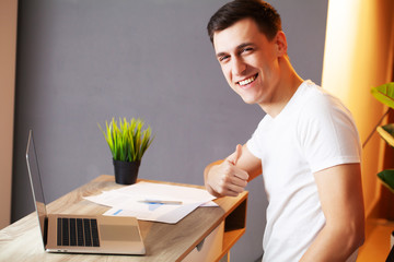 Successful businessman working in the office at computer